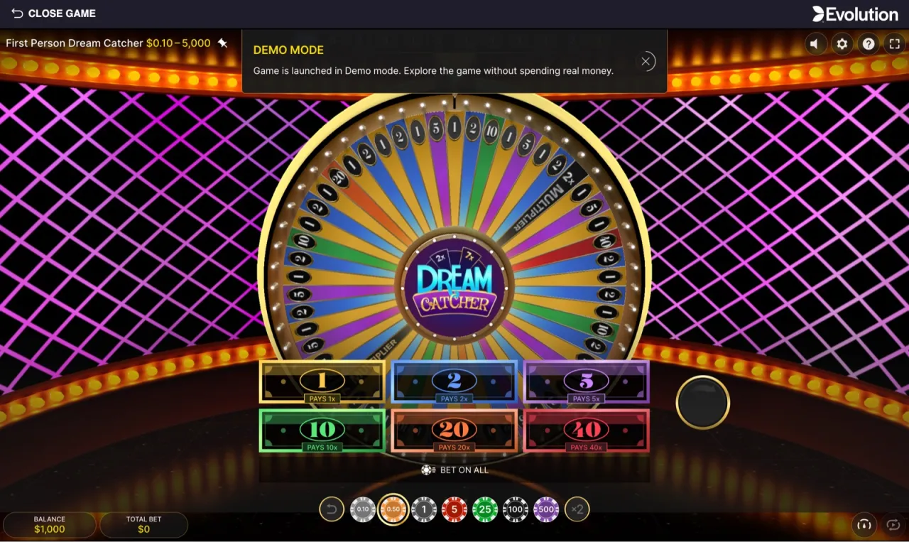 The full game view: 54-segment wheel up top, six numbered bet spots from 1 through 40 below, chip tray at the bottom, balance $1,000